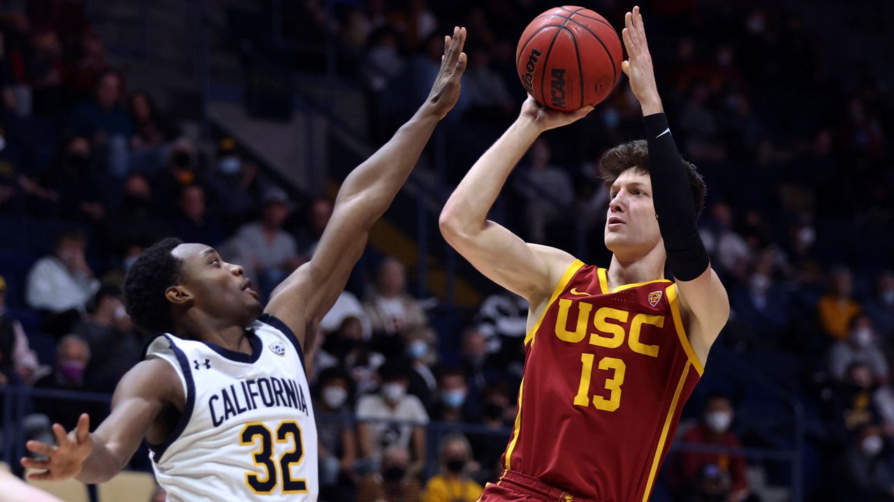 Southern California guard Drew Peterson (13) shoots against California guard Jalen Celestine (32) during the second half of an NCAA college basketball game in Berkeley, Calif., Thursday, Jan. 6, 2022. (AP Photo/Jed Jacobsohn)