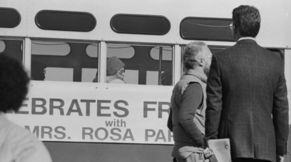 Rosa Parks rides as a ceremonial guest in a 1954 Flexible Twin Coach VIA bus in 1987 as part of VIA’s participation in the MLK March in San Antonio (Courtesy: St. Phillip's College)