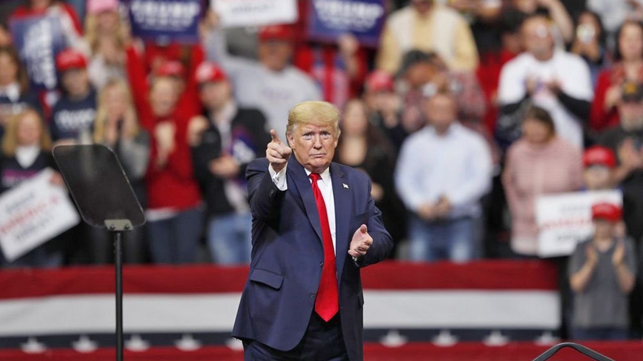 President Donald Trump reacts to audience members during a campaign rally at Drake University, Thursday, Jan. 30, 2020, in Des Moines, Iowa. (AP Photo/Charlie Neibergall)