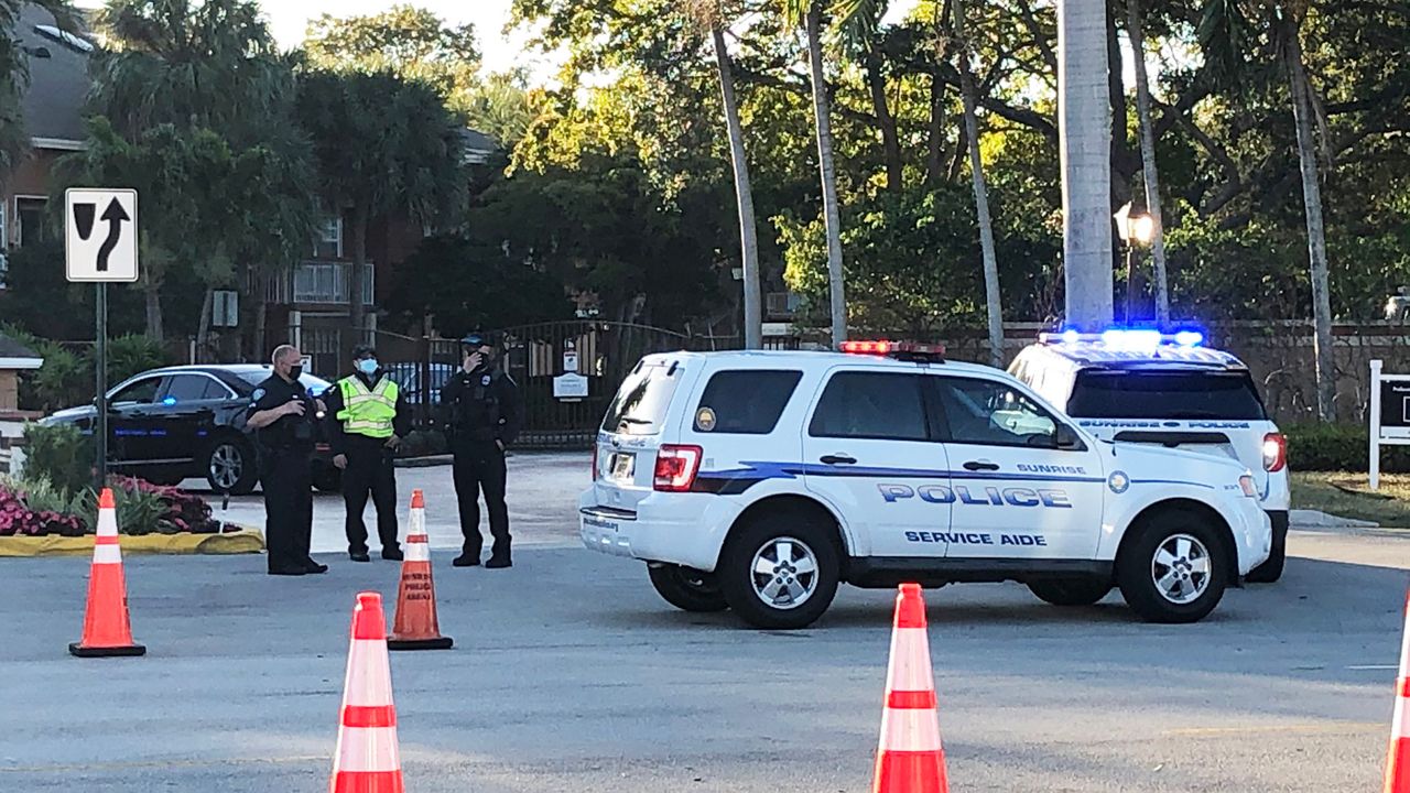 A SWAT vehicle that could withstand the bullets being fired from the suspect went and crashed through part of a building to rescue three wounded special agents. The shooting at the Sunrise, Fla., apartment complex left two FBI agents dead and the suspect. (Eric Mock/Spectrum News)
