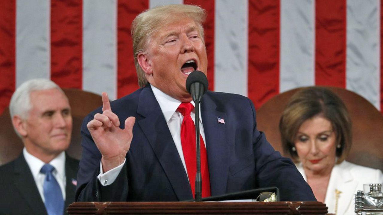 President Donald Trump delivers his State of the Union address to a joint session of Congress in the House Chamber on Capitol Hill in Washington, Tuesday, Feb. 4, 2020, as Vice President Mike Pence and Speaker Nancy Pelosi look on. (Leah Millis/Pool via AP)