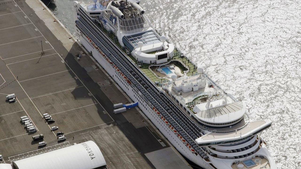 The cruise ship Diamond Princess is docked at Yokohama Port, near Tokyo, Friday, Feb. 7, 2020. Japan on Friday reported 41 new cases of a virus on the cruise ship that's been quarantined. About 3,700 people have been confined aboard the ship. (Sadayuki Goto/Kyodo News via AP)