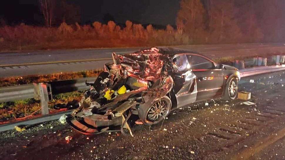 The crash happened on Interstate 75 after one of the semitractor trailers, which was carrying produce, came down on top of a car, just north of Ocala. (Marion County Fire Rescue)