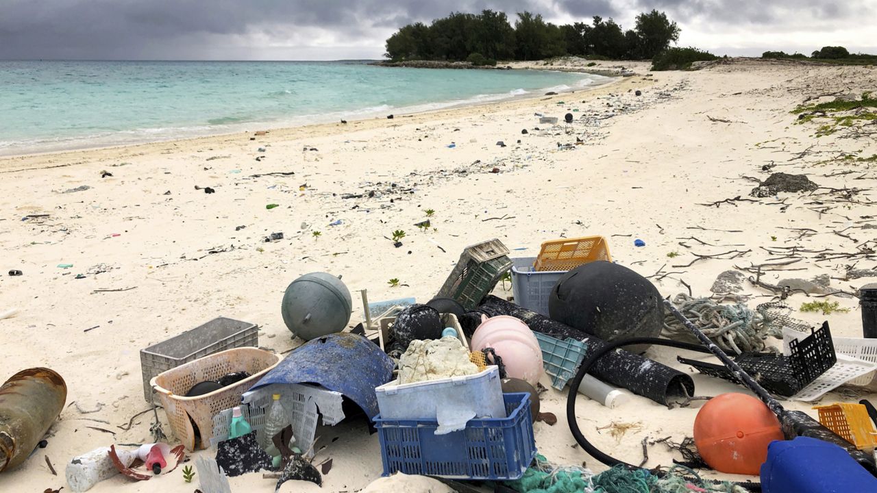 In this Oct. 22, 2019, photo, plastic and other debris sits on the beach on Midway Atoll in the Northwestern Hawaiian Islands. (AP Photo/Caleb Jones)