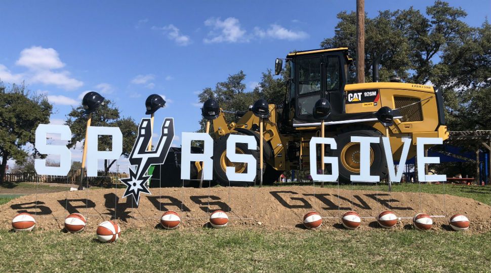 A "Spurs Give" sign presented during a press conference announcing the nonprofit's name change (Spectrum News/File)