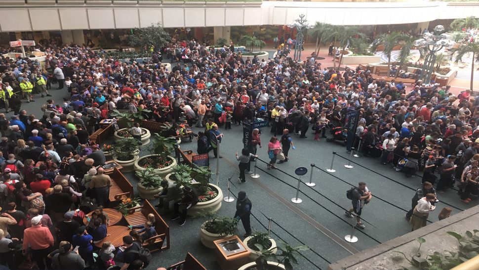 In this file picture from February 2, travelers at Orlando International Airport's Terminal A wait to be rescreened after the death of a TSA agent. (Spectrum News 13)