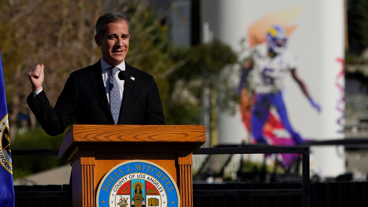Los Angeles Mayor Eric Garcetti speaks at a news conference outside SoFi Stadium, site of the NFL football Super Bowl later this month, Wednesday, Feb. 2, 2022, in Inglewood, Calif. (AP Photo/Marcio Jose Sanchez)
