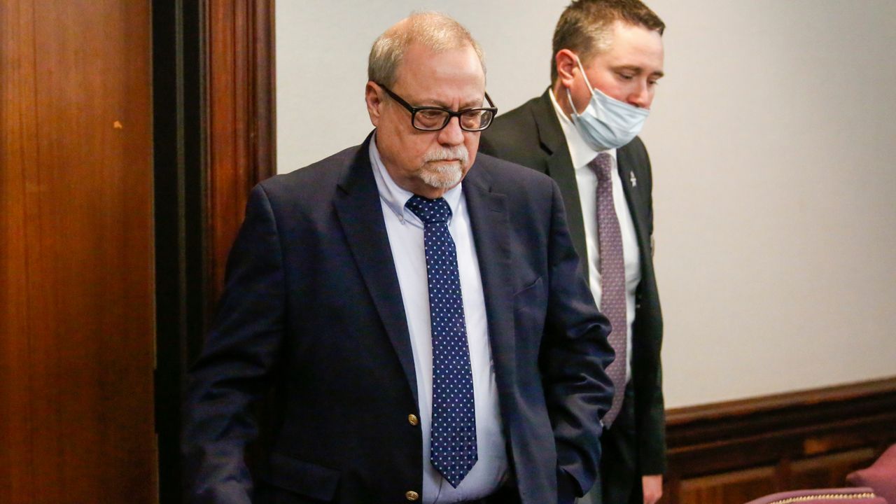 Gregory McMichael, left, is seen during the trial of William "Roddie" Bryan, Travis McMichael and Gregory McMichael, all charged with the February 2020 death of 25-year-old Ahmaud Arbery, Tuesday, Nov. 23, 2021, at the Glynn County Courthouse in Brunswick, Ga. (Octavio Jones/Pool Photo via AP)