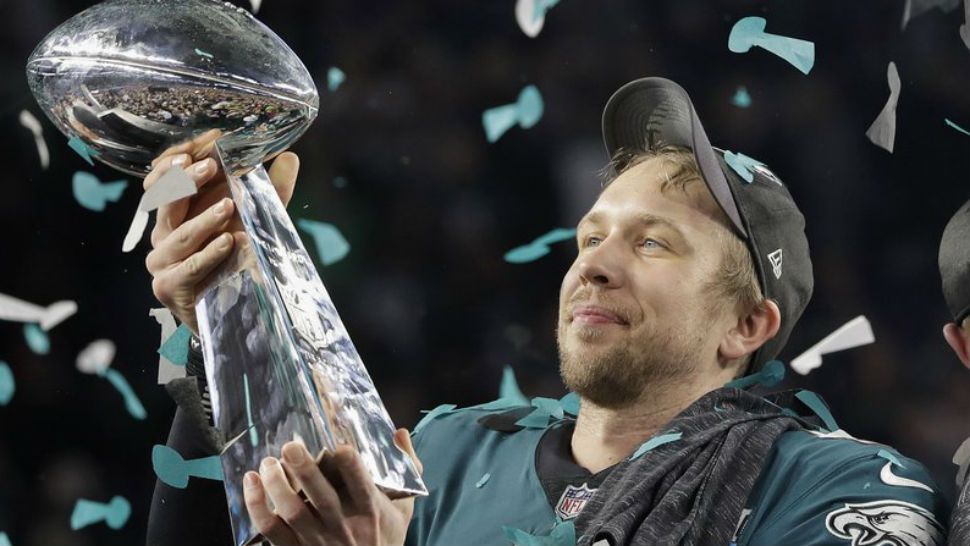 Philadelphia Eagles’ Nick Foles holds up the Vince Lombardi Trophy after the NFL Super Bowl 52 football game against the New England Patriots, Sunday, Feb. 4, 2018, in Minneapolis. The Eagles won 41-33. (AP Photo/Matt Slocum)