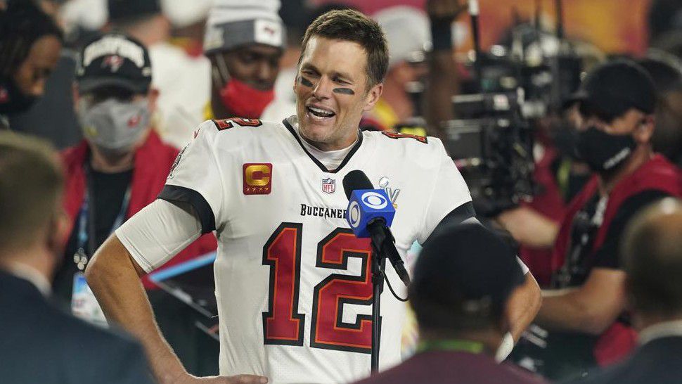 FILE - Tampa Bay Buccaneers quarterback Tom Brady (12) is interviewed on the field after the NFL Super Bowl 55 football game against the Kansas City Chiefs, in Tampa, Fla., in this Sunday, Feb. 7, 2021, file photo. Sometimes, the abdicating king, or the deposed one, returns to his kingdom. It happens often enough in the NFL, yet rarely is as newsworthy as Tom Brady, who led the Patriots to six Super Bowl titles, going back to New England. He'll do that on Sunday night eight months after taking the Tampa Bay Buccaneers to the top. (AP Photo/Steve Luciano, FIle)