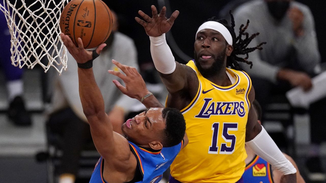 Oklahoma City Thunder forward Darius Bazley, left, shoots as Los Angeles Lakers center Montrezl Harrell defends during the second half of an NBA basketball game Monday, Feb. 8, 2021, in Los Angeles. (AP Photo/Mark J. Terrill)