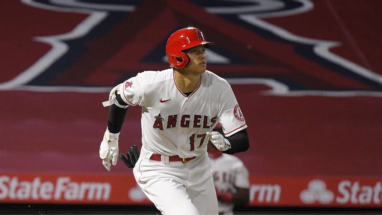 Los Angeles Angels' Shohei Ohtani, of Japan, runs to first as he hits a three-run home run during the fourth inning of a baseball game against the Seattle Mariners Wednesday, July 29, 2020, in Anaheim, Calif. (AP Photo/Mark J. Terrill)
