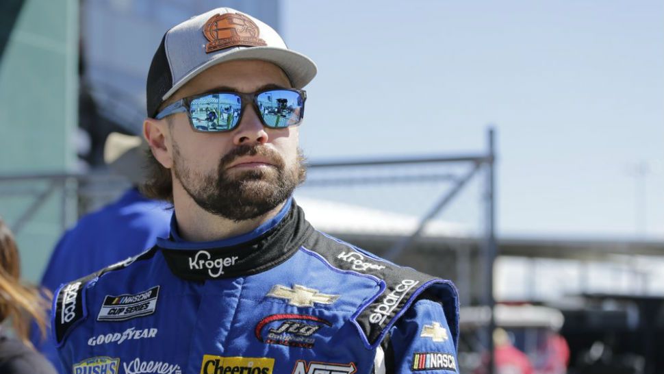 Ricky Stenhouse Jr. walks along pit road before NASCAR auto race qualifying at Daytona International Speedway, Sunday, Feb. 9, 2020, in Daytona Beach, Fla. (AP Photo/Terry Renna)