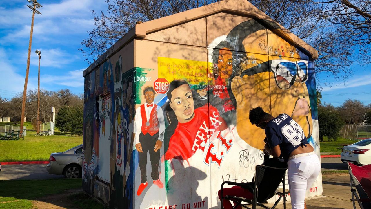 This mural by Michael Malik Williams at Givens Park depicts community members who have become victims of gun violence and police brutality. (Spectrum News)  