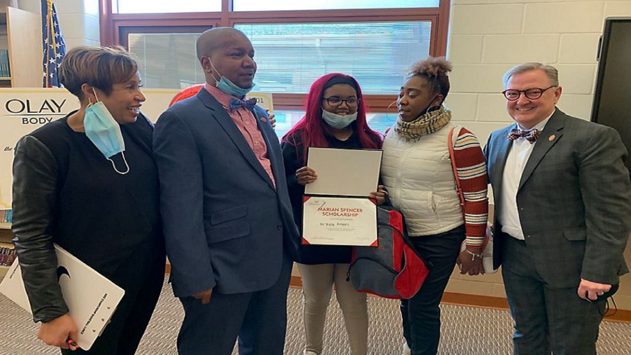 Ke'Ayra Rogers takes picture with her Marian Spencer Scholarship 