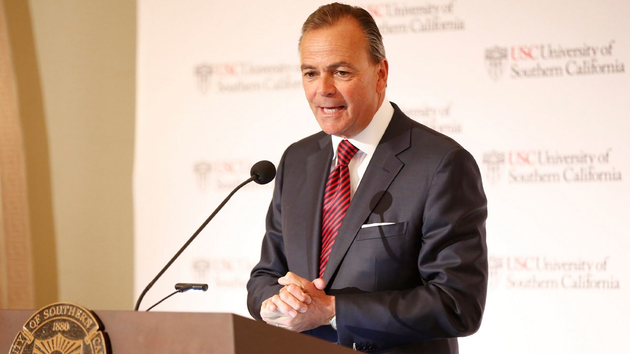 Rick Caruso, chairman of the University of Southern California Board of Trustees announces Carol Folt as the USC's 12th president in Los Angeles Wednesday, March 20, 2019. (AP Photo/Damian Dovarganes)