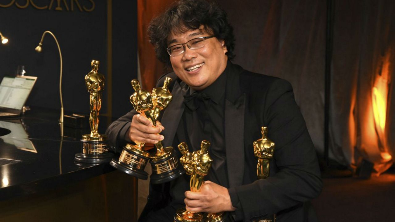 Bong Joon-ho holds the Oscars for best original screenplay, best international feature film, best directing, and best picture for "Parasite" at the Governors Ball after the Oscars on Sunday, Feb. 9, 2020, at the Dolby Theatre in Los Angeles. (Photo by Richard Shotwell/Invision/AP)