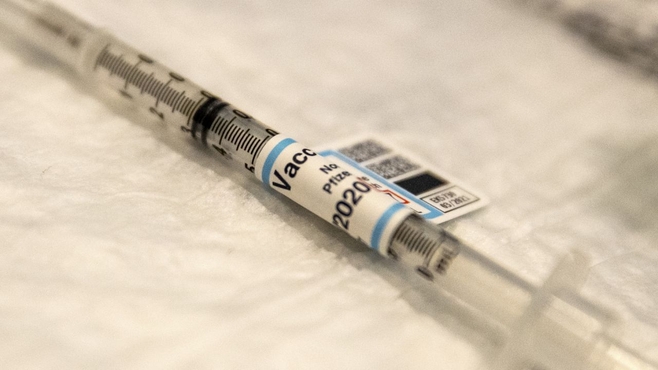 A syringe of Covid-19 vaccine is ready on a table at Ronald Reagan UCLA Medical Center where care workers received the vaccine on Wednesday, Dec. 16, 2020 in Westwood, CA. (Brian van der Brug/Los Angeles Times via AP, Pool)