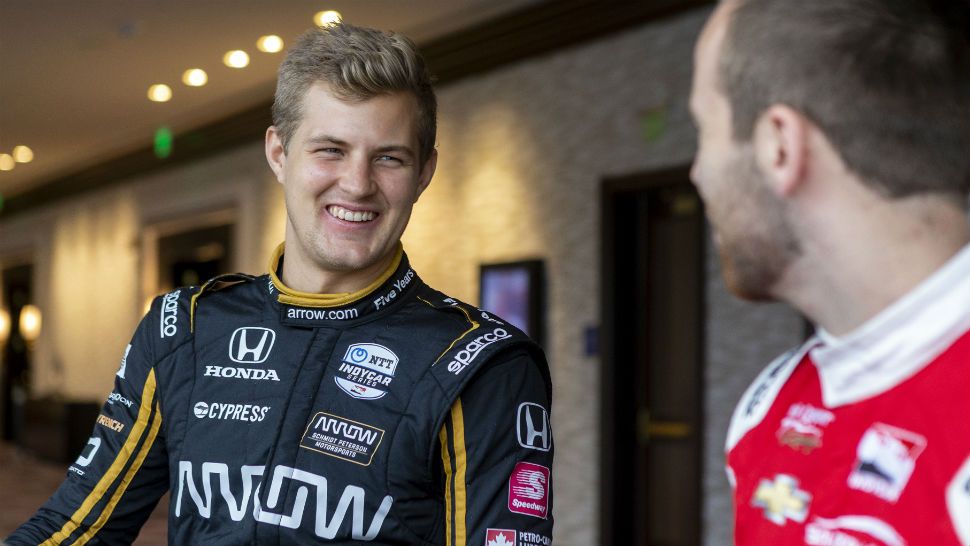 IndyCar driver Marcus Ericsson, of Sweden, speaks with fellow driver Ed Jones during IndyCar auto racing media day, Monday, Feb. 11, 2019, in Austin, Texas. (AP Photo/Stephen Spillman)