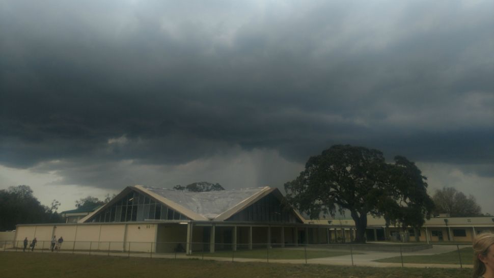 Storms darken skies over a high school in DeLand. (DJ Headley/viewer)