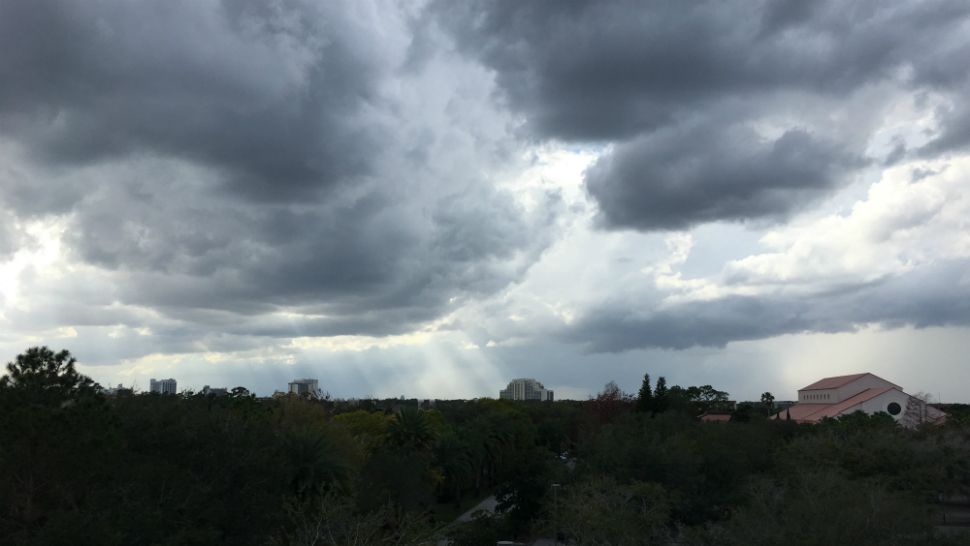 Shafts of sunlight breaking through the clouds west of Lake Buena Vista. (Daniel Wallace/viewer)