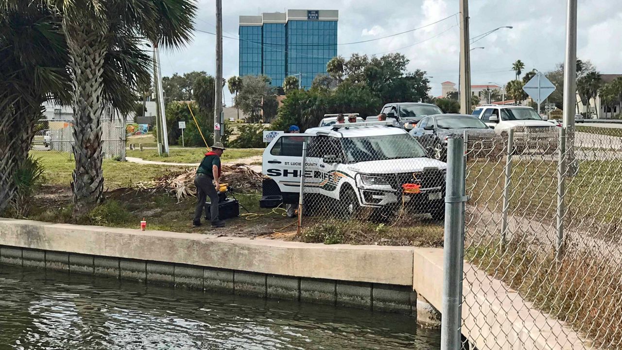 Authorities on scene at the Indian River, near the Melbourne Causeway, where the body of 21-year-old Matthew Robineau was found Tuesday afternoon. (Greg Pallone/Spectrum News 13)