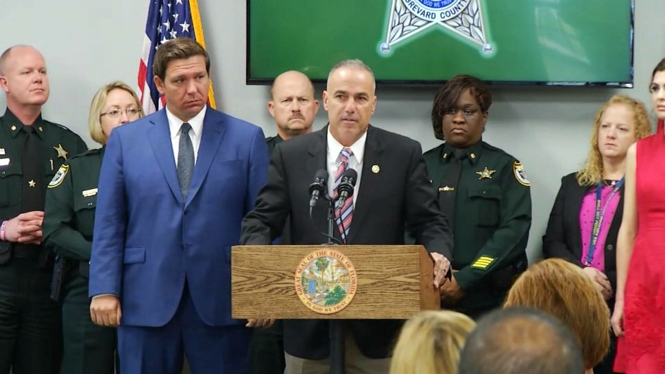 Parkland parent Andrew Pollack speaks during a news conference Wednesday in Titusville, where Gov. Ron DeSantis (left of Pollack) announced an executive order mandating school security changes. (Jon Shaban/Spectrum News)
