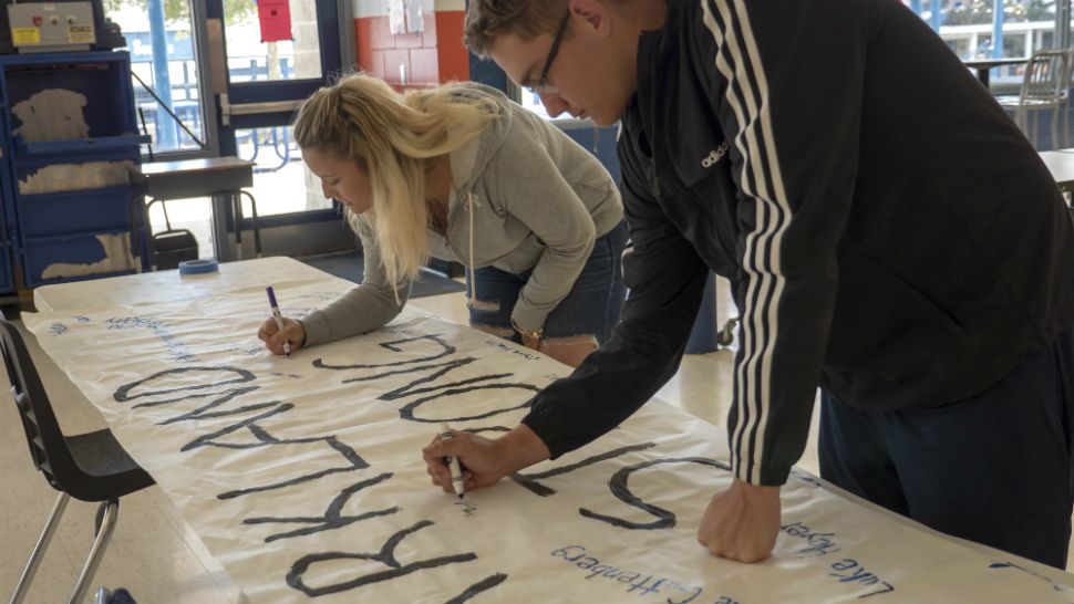 Students at Central High School in Hernando County sign a banner for Marjory Stoneman Douglas High School on Thursday. The banner will be sent to Parkland. (Courtesy of Hernando County Schools)