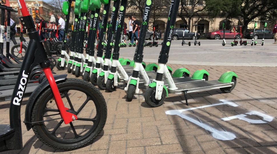 Scooters on sidewalks in San Antonio with parking decal marking February 14, 2019 (Spectrum News)