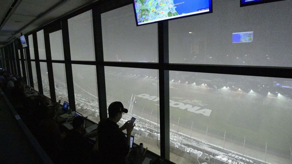 A downpour, as viewed from the press box, forces a postponement of the NASCAR Daytona 500 auto race at Daytona International Speedway, Sunday, Feb. 16, 2020, in Daytona Beach, Fla. (AP Photo/Phelan M. Ebenhack)