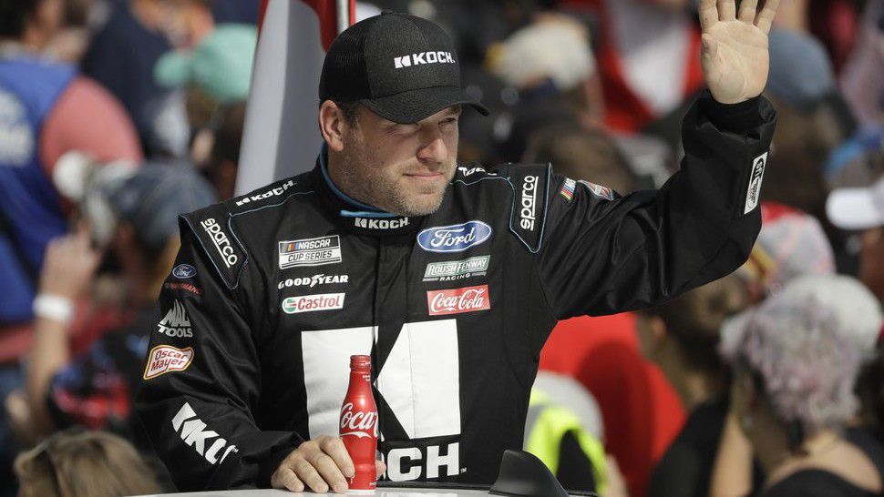 FILE - In this Feb. 16, 2020, file photo, Ryan Newman waves before the NASCAR Daytona 500 auto race at Daytona International Speedway in Daytona Beach, Fla. Newman says he will be ready to race when NASCAR resumes competition. He suffered a heady injury in the season-opening race at Daytona International Speedway. NASCAR says he still must be medically cleared. (AP Photo/Chris O'Meara, File)