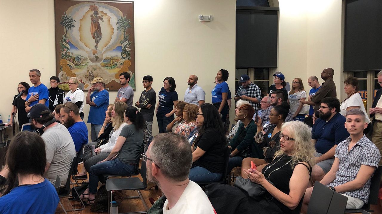 Attendees at a Democratic Presidential Candidate forum in Tampa Saturday night wait to ask surrogates for the candidates questions. (Mitch Perry/Spectrum Bay News 9)