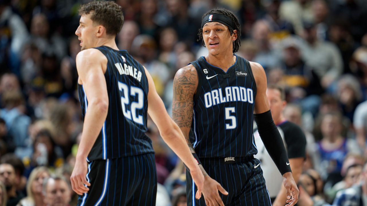 Orlando Magic forwards Franz Wagner (22) and Paolo Banchero (5), pictured in a game earlier this season against the Nuggets, face one another Friday night in Game 1 of the Jordan Rising Stars mini-tournament at NBA All-Star Weekend. (AP Photo/David Zalubowski)