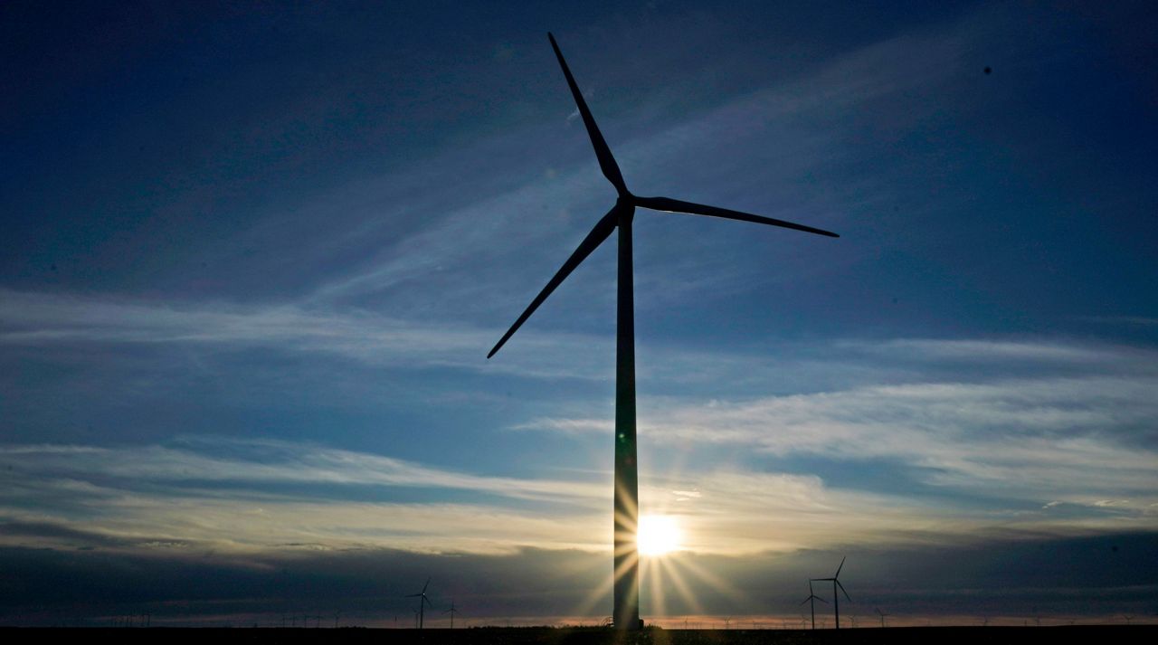 In this Jan. 13, 2021, file photo a wind turbine is silhouetted against the rising sun Wednesday, Jan. 13, 2021, near Spearville, Kan. (AP Photo/Charlie Riedel, File)