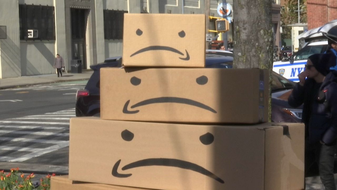 Three brown boxes showing frowning faces stacked up on top of each other.