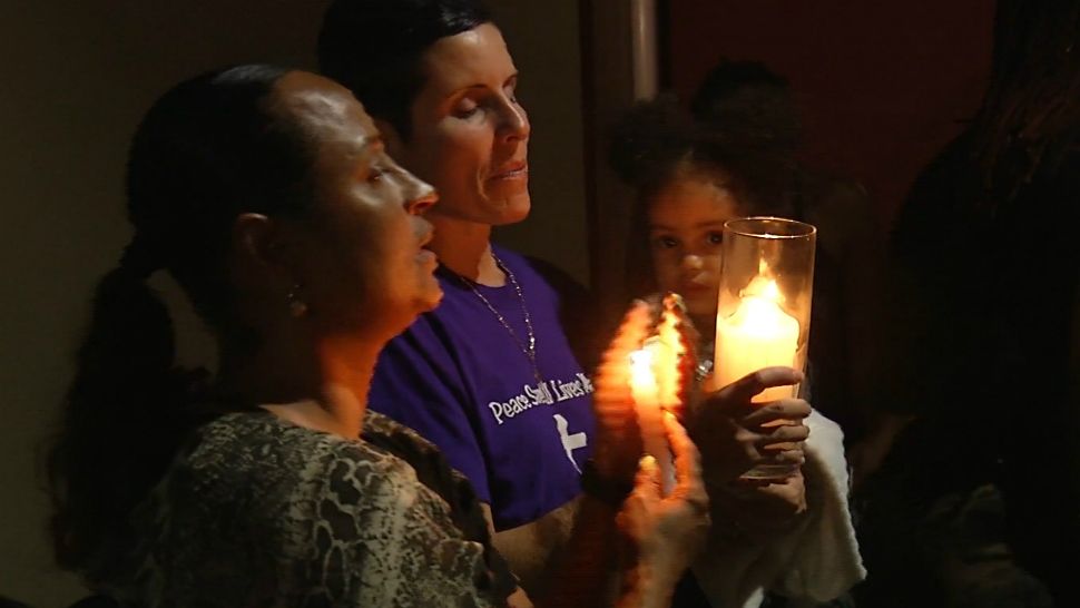 A candlelight vigil was held Sunday night for Tashaun Jackson, a mother of 4 whose body was found in Osceola County after she went missing about a week earlier. (Spectrum News 13)