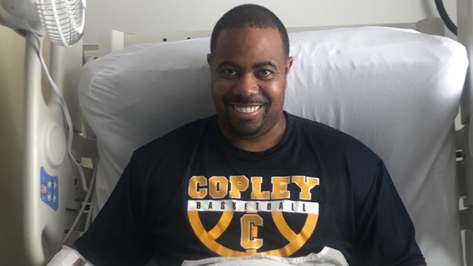 Antoine Campbell wearing a black and orange Copley Basketball t-shirt