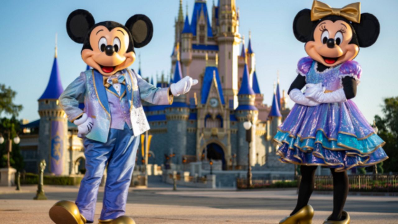 Starting October 1 at Walt Disney World, Mickey and Minnie Mouse can be seen wearing new costumes designed for the resort's 50th anniversary celebration. (Matt Stroshane/Walt Disney Co.)