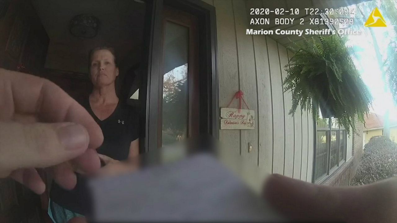 Rebecca Fierle is seen in video taken from a deputy's body-worn camera during her arrest February 10 on elder-abuse charges. She told the deputy she'd had a deal to turn herself in the next day. (Marion County Sheriff's Office)