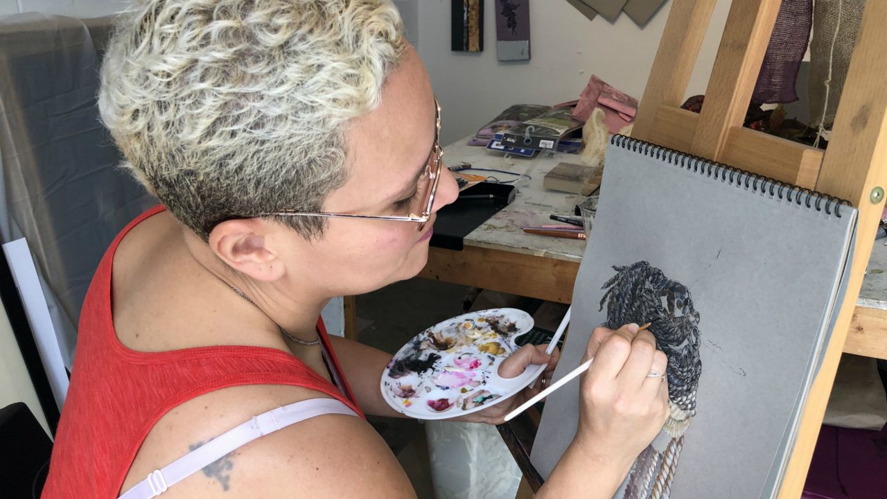 Wanda Raimundi-Ortiz hopes her artwork inspires fellow Afro-Latinos to embrace their identities and culture. (Jesse Canales/Spectrum News)