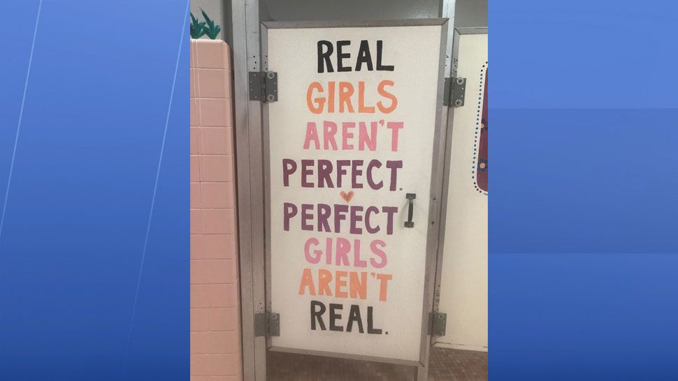 A small group of students at Carlton Palmore Elementary in Lakeland have painted motivational messages on bathroom stalls. (Stephanie Claytor/Spectrum News)