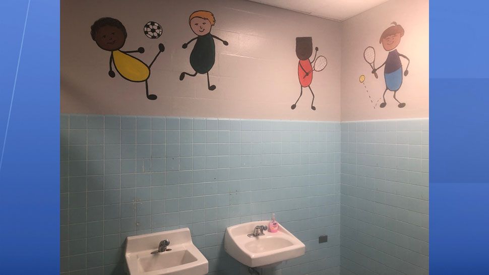 A small group of students at Carlton Palmore Elementary in Lakeland have painted motivational messages on bathroom stalls. (Stephanie Claytor/Spectrum News)
