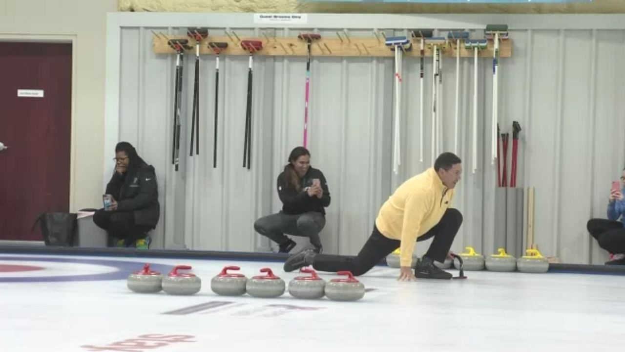 Panthers coach Ron Rivera tries curling