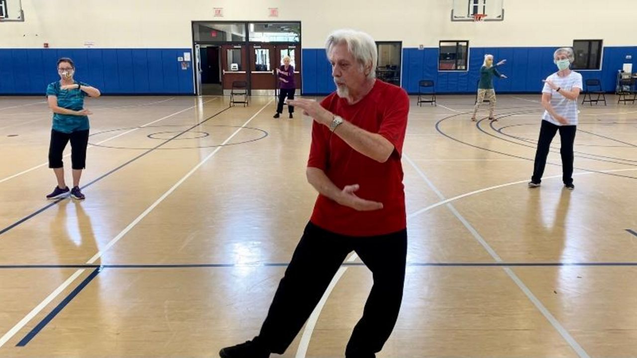 Eric Raboy, 70, leads a group of seniors in Chinese martial arts Tuesday at the Winter Park Community Center. (Pete Reinwald/Spectrum News 13)