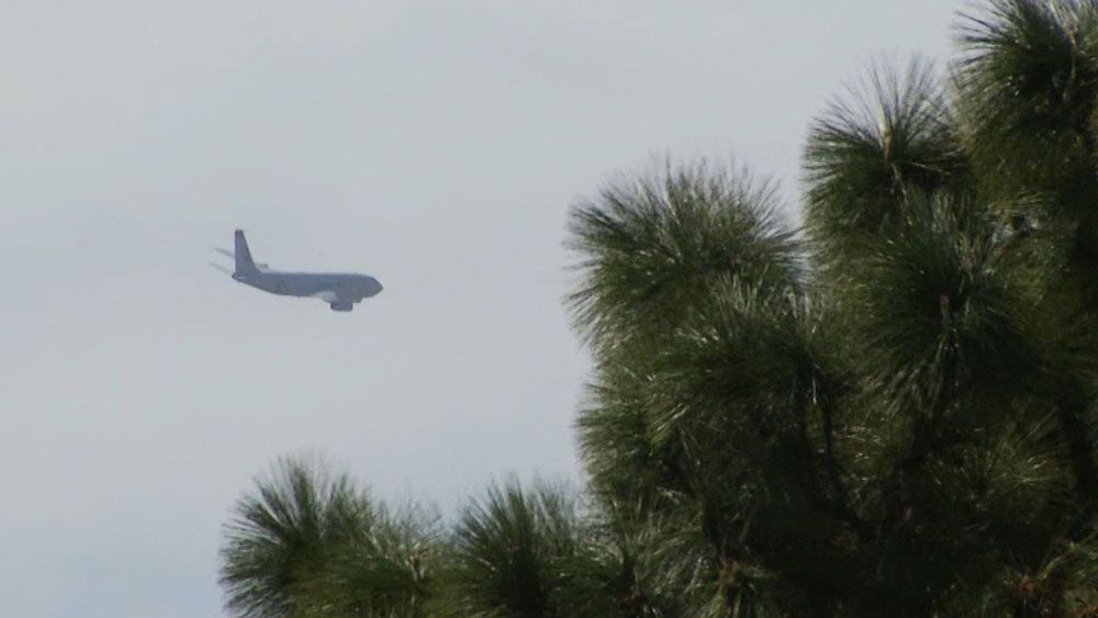 A military plane flies low over south Brevard County Monday, frightening residents. (Spectrum News)