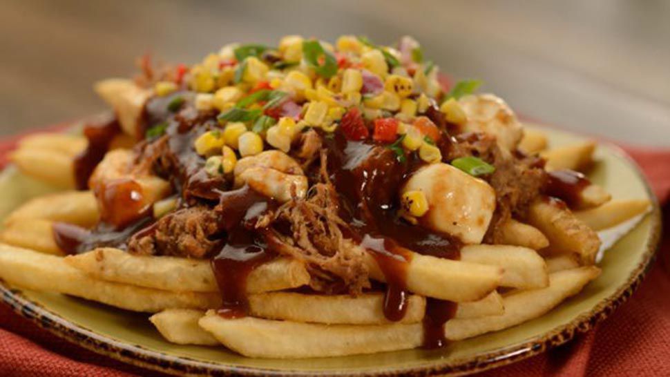 Coffee-rubbed Pork Poutine with Barbecue Demi-Glace, Fire-roasted Corn Relish, and Cheese Curds at the Epcot Flower and Garden Festival. (Courtesy of Disney)