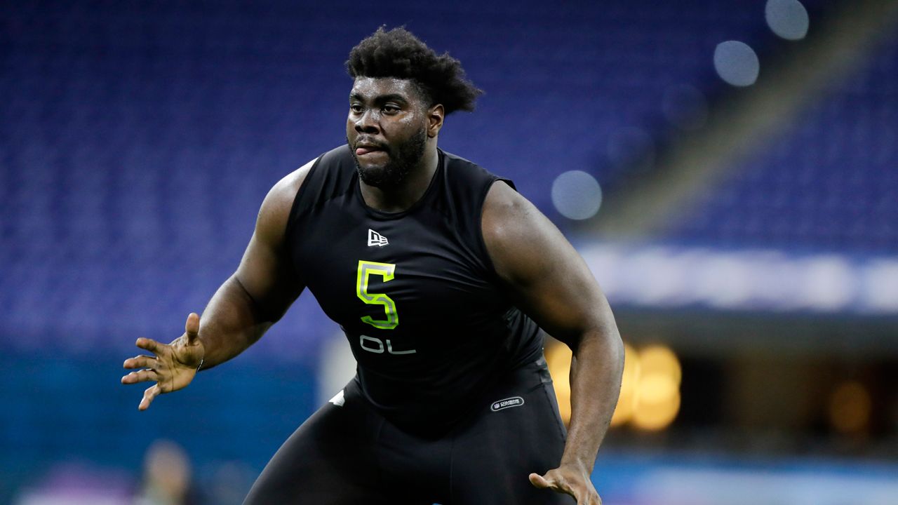 Louisville offensive lineman Mekhi Becton runs a drill at the NFL football scouting combine in Indianapolis, Feb. 28, 2020. (AP Photo/Michael Conroy)