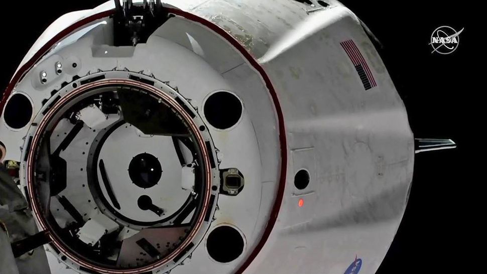 An unmanned SpaceX Crew Dragon capsule docked with the International Space Station for a few days during a successful mission in March. (NASA TV file)