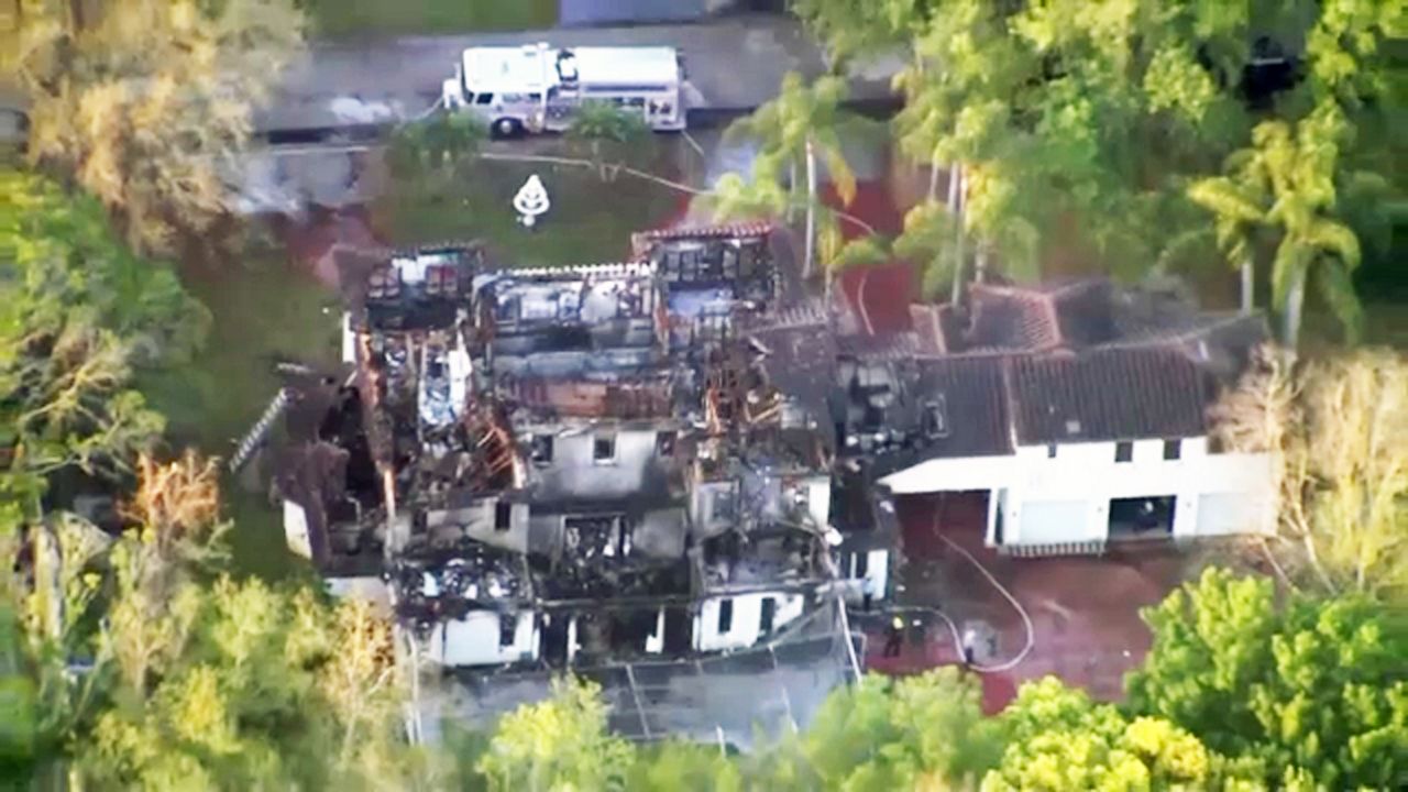 Orange County Fire Rescue firefighters battled a fire at former Rep. Alan Grayson’s home on the 8000 block of Oak Park Drive in Windermere. (Sky 13)
