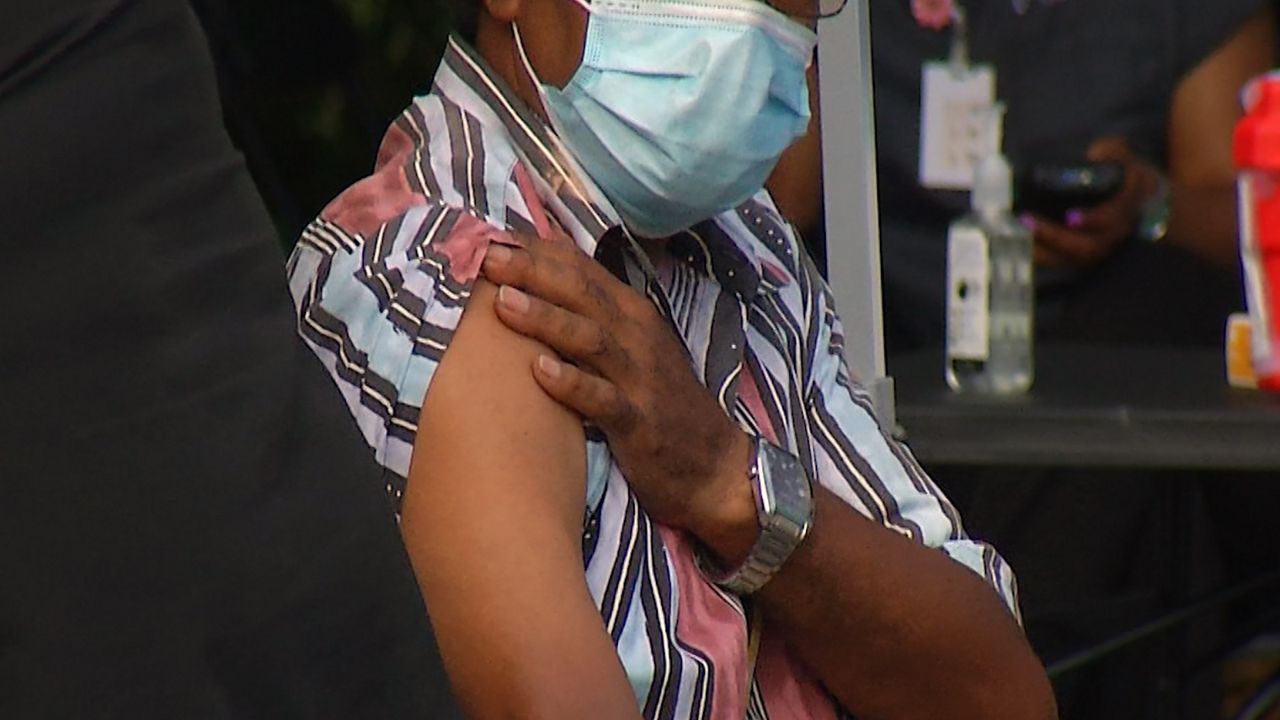 Person preparing to receive vaccine